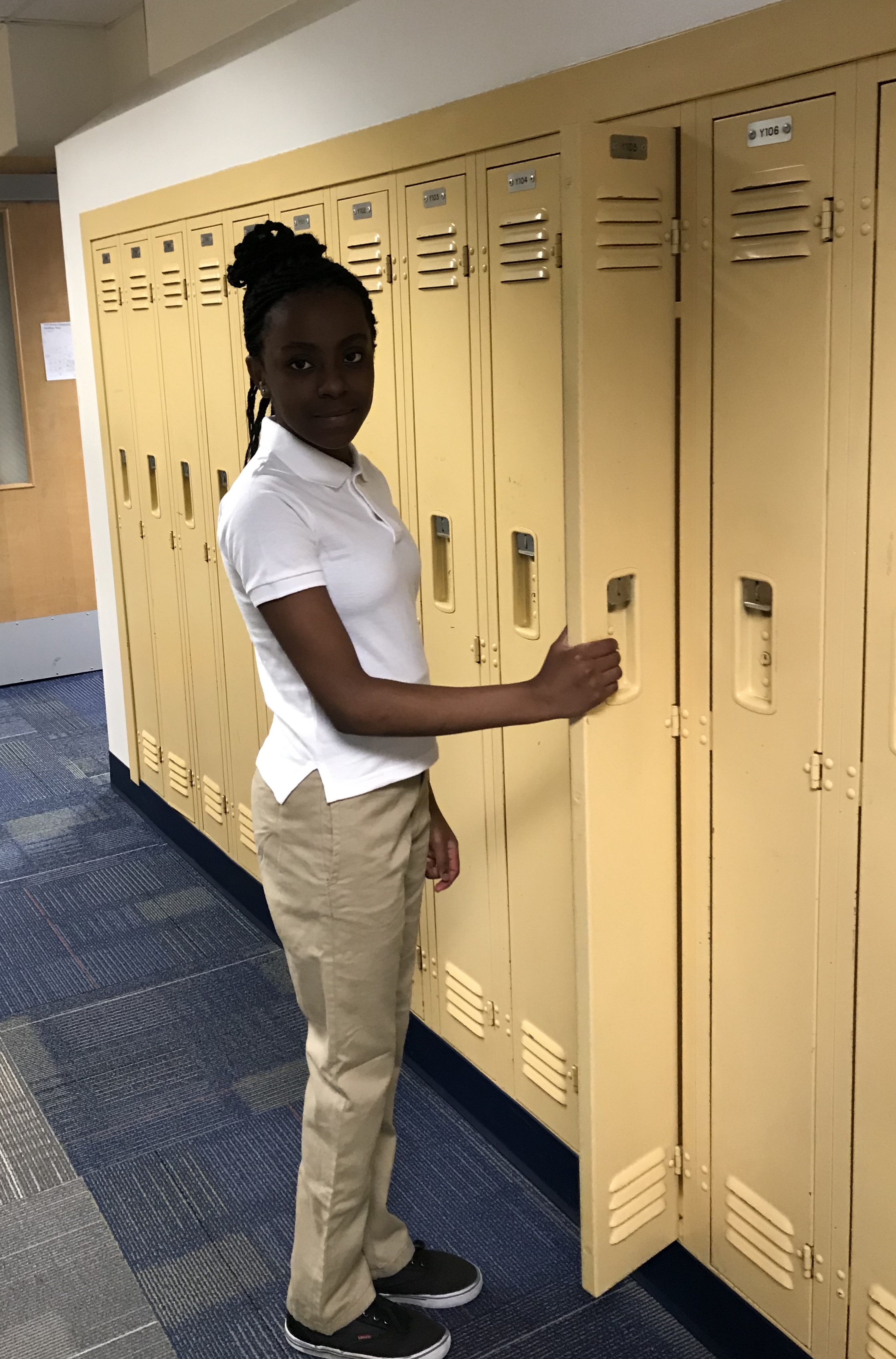 girl in uniform-white collared short sleeved shirt with tan long pants 